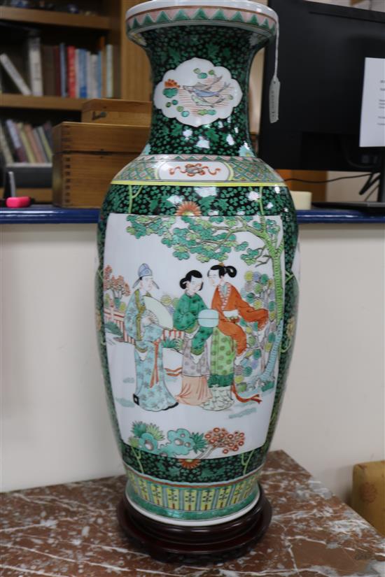 A pair of large Chinese porcelain vases with hardwood stands